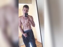 Shirtless muscle boy reveals his cock