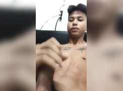 Tattooed Asian muscle boy wanks and cums