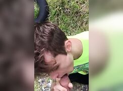 Sucking his friend outside