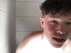 Horny cute naked twink wanking in the shower