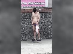 Russian guy pees on the sidewalk