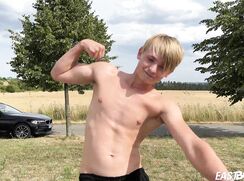 Cute teen blonde boy shows off his abs