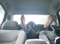 Black twink solo stroking in car in public