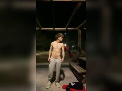 Pablo jerks off in the park at night.