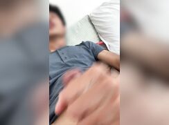 Blue shirt boy strokes his dick and cums