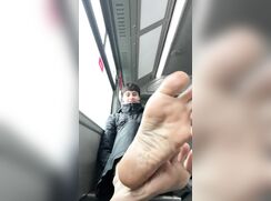Public transport boy feet soles
