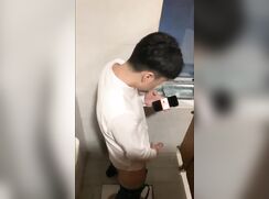 Chinese twink caught in public toilet