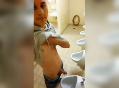 Uncut lad at urinal [German]