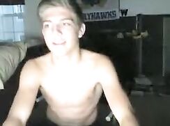 Webcam boy in red Kansas hoodie strips, wanks and cums