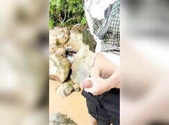 horny asian busting a nut at the riverside