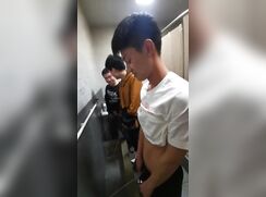 A male is pissing in the toilet 16