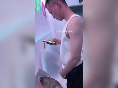 A male is pissing in the toilet 19