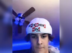 Hot Brunette with a cap on jacks off and cums - AI Enhanced