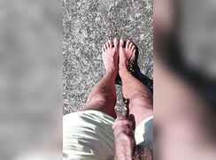 Pissing on my feet outdoors