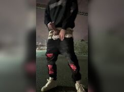 Stroking on the street at night