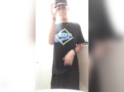 Young latino jerks his long dick
