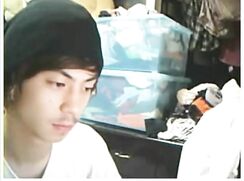 Asian webcam boy wanks and cums while on the phone