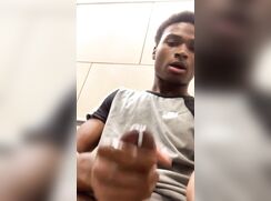 Black twink jerks in public bathroom