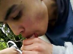 Teen gives blowjob to friend in the park