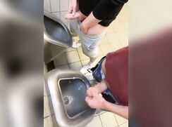 Brotherage in public bathroom