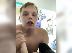 Chubby blonde boy gets naked and sucks a dildo