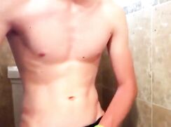 Cute blond puts on a show in the bathroom