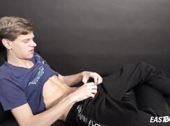 Slim boy Jake Bode with nice abs jerking his cock