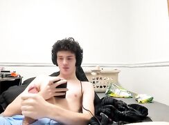 Curly haired dude watching porn