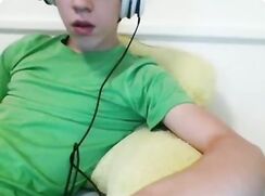 Cute brunette twink cums on his face