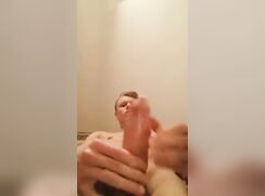 cute big dick blonde jerking off with condom cumming out
