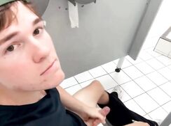Teenager jerks off in a public toilet stall with the door wide open
