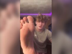 Verbal handsome blonde shows his perfect feet