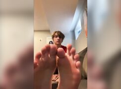 Boy shows his soft soles