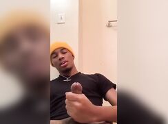 Sweet black boy milks his snake