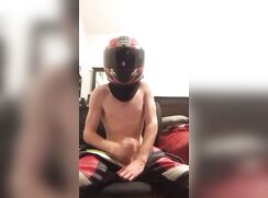 Hot boy with motorcycle helmet cums well