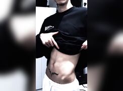 A skinny twink teases his body