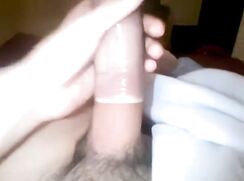 Hot teen boy cums into a condom