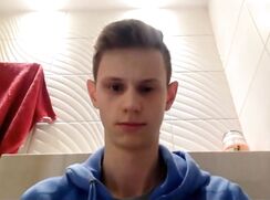Twink heads to the bathroom to dump his load into the toilet