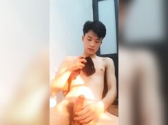 Asian cleans up his cum with underwear