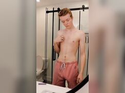 Horny ginger boy wanks in the bathroom