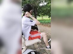 Jerking off next to his friend on the park bench