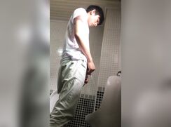cute asian boy peeing