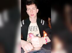 cute blonde guillo heping a frien at beach bonfire