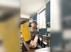 Blond boy shows off his feet and smells his socks - no sound