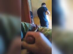 Shy dorm-mate jerks-off with back to his roommate, who is also jerking-off