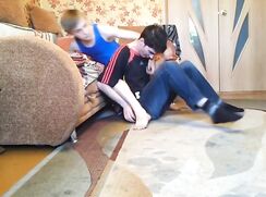 Blue singlet boy wrestles friend