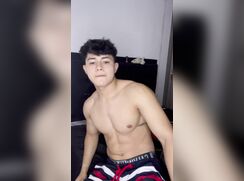 Buff Latino jacks and nuts in his room