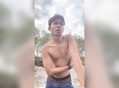 A young Indonesian man tries on a pair of briefs