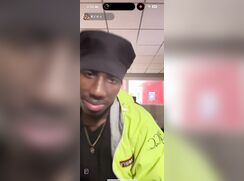 Security guard showing off his BBC print while he works