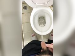 asian boy pissing in toilet